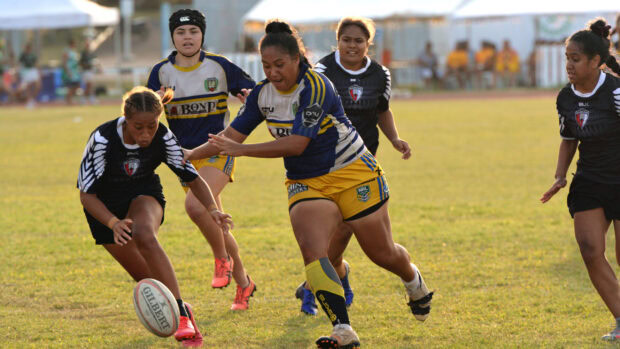 A female rugby league player attempts to catch the ball during a competitive game, 2K Desktop Wallpaper