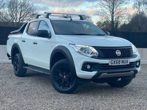 A white Fiat Fullback is parked on a gravel area under a cloudy sky, HD Desktop Wallpaper