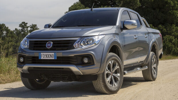 A grey Fiat Fullback pickup truck is parked on a dirt road in a forest area, HD Desktop Wallpaper