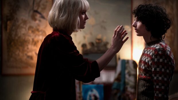 A tense moment features Finn Wolfhard facing a woman in a dimly lit room, Finn Wolfhard Wallpapers, 4K Desktop Wallpaper