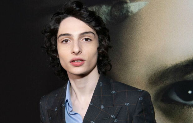 Finn Wolfhard looks to the camera wearing a patterned suit jacket, HD Desktop Wallpaper