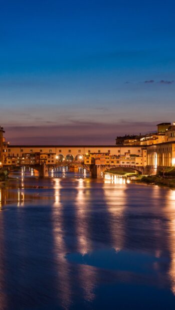 The Florence Wallpapers show the historic bridge beautifully lit at twilight, 2K Mobile Wallpaper