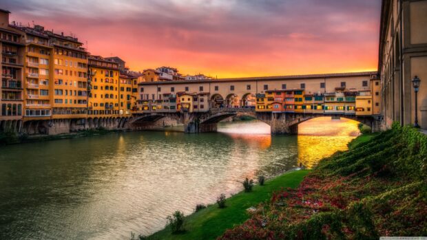 The Florence Wallpapers showcase the historic bridge over the river with vibrant evening skies, 2K Desktop Wallpaper