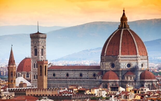 The Florence Wallpapers showcase the iconic cathedral dome and city skyline during a warm sunset, 2K Desktop Wallpaper