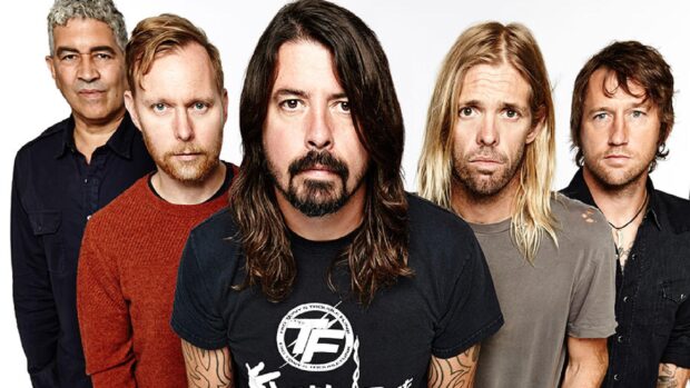 The Foo Fighters band members stand together in an intense group portrait, 2K Desktop Wallpaper