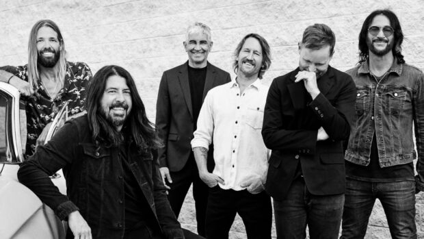 The Foo Fighters band poses casually together near a wall, HD Desktop Wallpaper