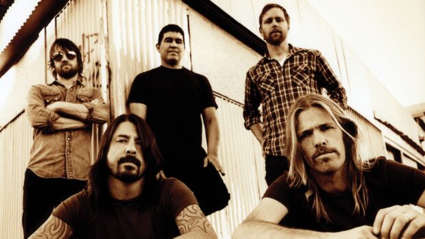 The Foo Fighters band members pose together in a sepia toned photo, HD Desktop Wallpaper