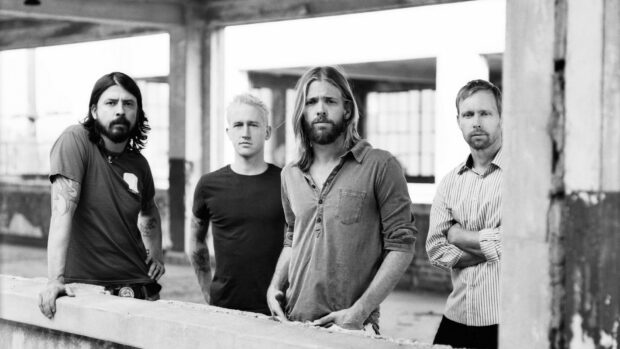 The Foo Fighters band stands in an urban setting looking serious, HD Desktop Wallpaper