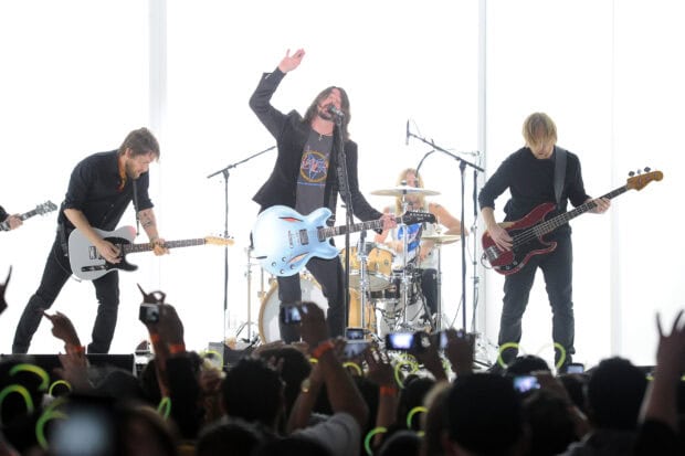 Foo Fighters performing live on stage in front of a large crowd, 2K Desktop Wallpaper