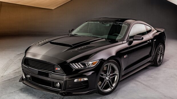 Black Ford Mustang car parked in a studio with detailed front and side views