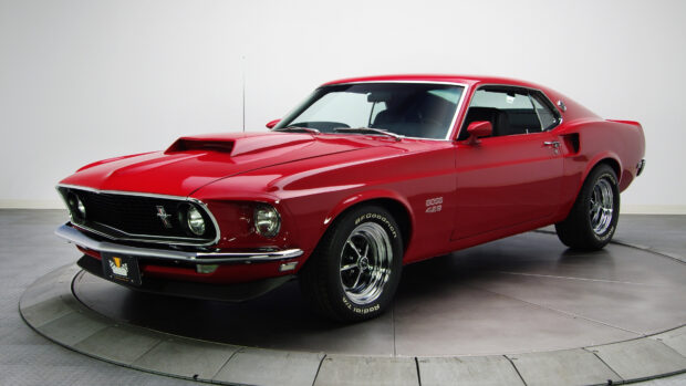 Classic red Ford Mustang car in a studio setting with detailed features