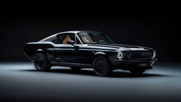 Classic Ford Mustang with black paint and modern headlights in a dark studio setting