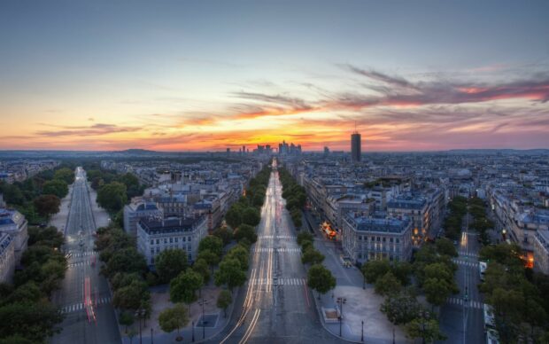 A beautiful cityscape of France with illuminated streets and skyline at sunset