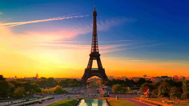 The Eiffel Tower stands tall at sunset in France cityscape with clear sky and vibrant colors