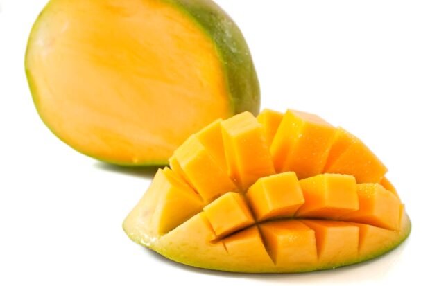 A close up of fresh ripe mango cut into cubes with bright yellow flesh, HD Desktop Wallpaper