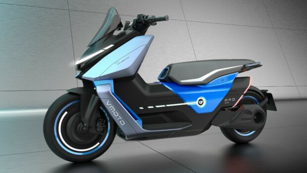 A futuristic electric scooter in blue and silver is shown from the side against a tiled wall, HD Desktop Wallpaper