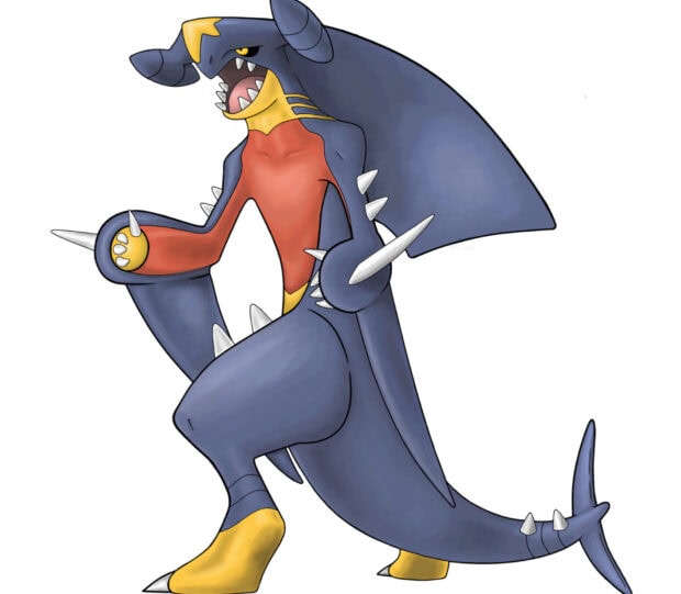 Garchomp character standing with sharp fins and dark blue skin in a dynamic pose