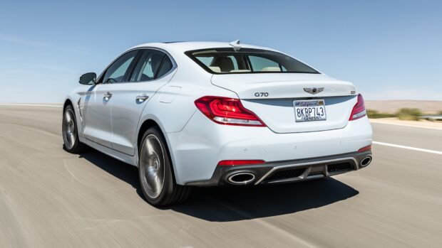A white Genesis car is driving fast on a clear sunny day with desert surroundings, HD Desktop Wallpaper