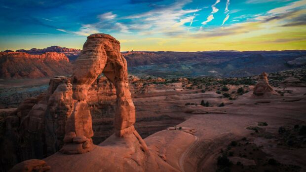 Natural geology formation of sandstone arch in desert landscape