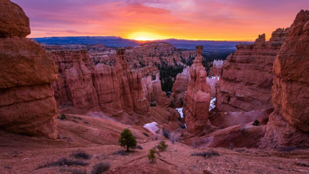 Red rock formations showcasing unique geology at sunset in a vast canyon landscape