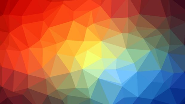Colorful geometric abstract pattern with triangles in warm and cool shades of red yellow and blue