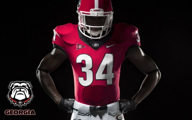 Georgia football player wearing number 34 jersey standing with hands on hips