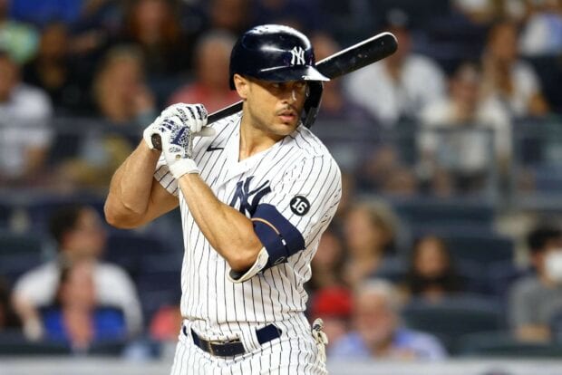 Giancarlo Stanton preparing to bat during a baseball game in a New York Yankees uniform