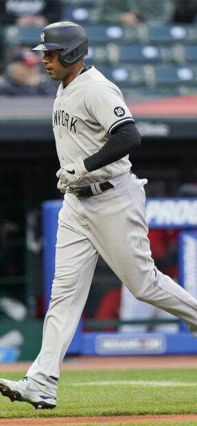 Giancarlo Stanton in New York baseball uniform running on the field during a game