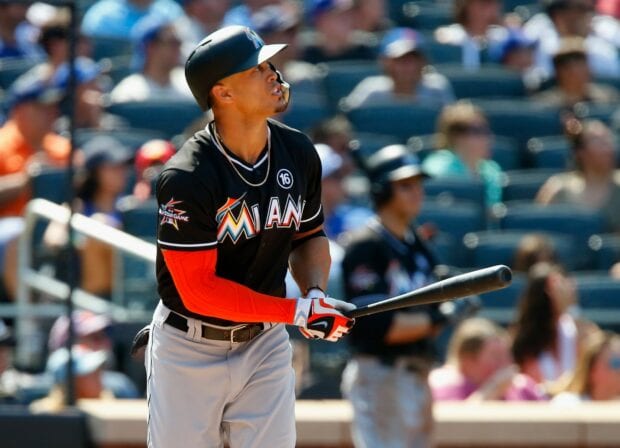 Giancarlo Stanton focused during a baseball game in Miami uniform