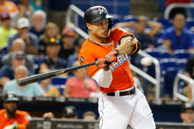 Giancarlo Stanton preparing to hit a baseball during a game in Miami