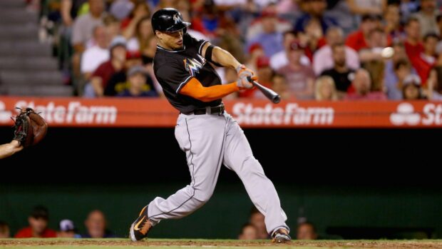 Giancarlo Stanton swinging a baseball bat during a game for the Miami Marlins