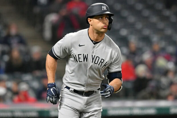 Giancarlo Stanton in New York baseball uniform running during a game