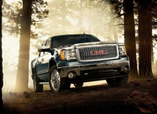 A GMC truck parked in a misty forest with sunlight filtering through the trees, HD Desktop Wallpaper