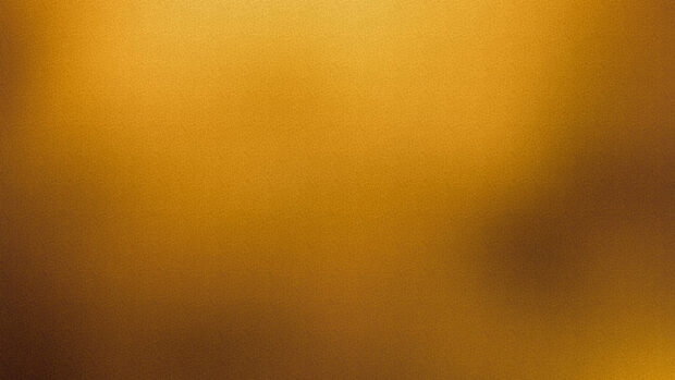 Gold foil texture with intricate cracks pattern in warm golden tones