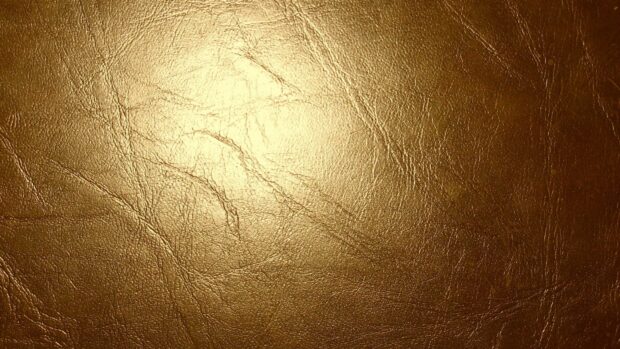 Close up view of gold foil texture with shiny metallic surface