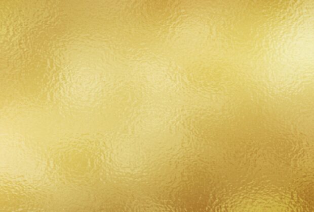 Smooth gold foil texture with shiny metallic look in high definition quality