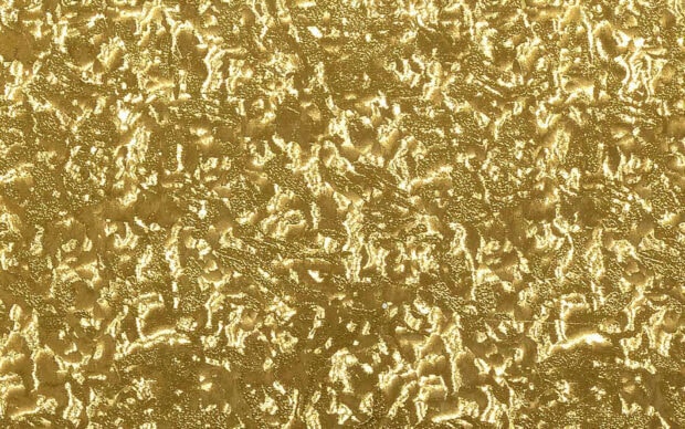 Gold foil texture with shiny and rough surface showing luxury and elegance