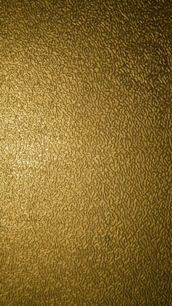 Detailed gold foil texture with intricate patterns in high definition