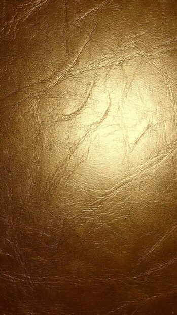 Detailed golden foil texture with natural creases and wrinkles on the surface
