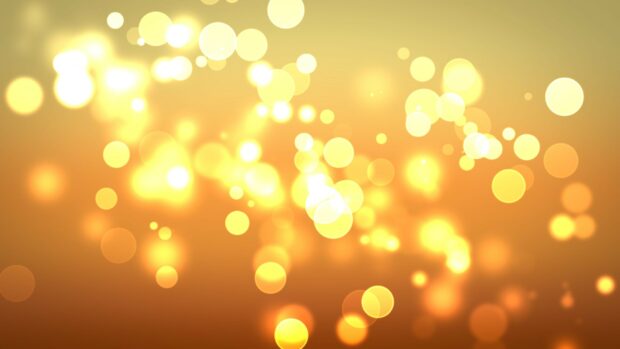 Glowing golden lights softly scattered on a blurred background creating a warm atmosphere