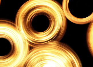 Circular golden light rings swirl against a dark background creating a glowing abstract pattern