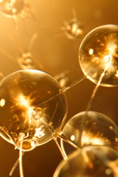 Transparent golden spheres glowing with gold lights in an abstract composition