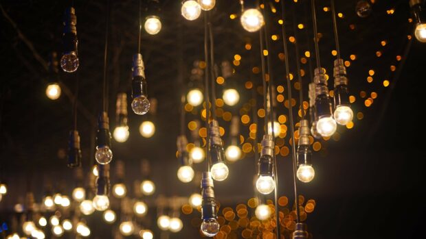 Hanging light bulbs create a warm gold lights atmosphere with a soft glowing effect