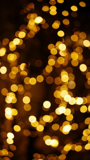 Soft bokeh effect of gold lights creating a festive atmosphere