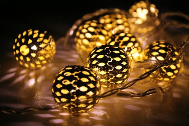 Golden lights casting intricate patterns on smooth surfaces in a beautiful display of gold lights