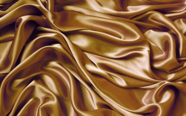 Golden smooth silk texture with natural folds and sheen, 2K Desktop Wallpaper