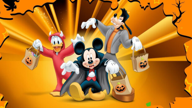 Goofy character celebrating Halloween with Mickey Mouse and Donald Duck in costumes
