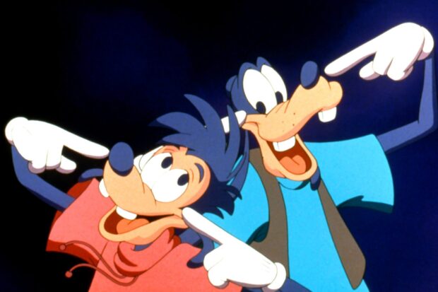 Two goofy characters smiling and pointing at their faces with joyful expressions