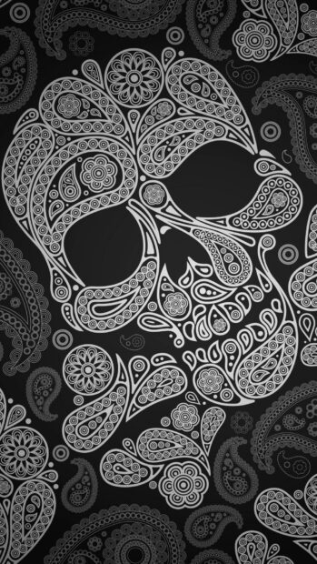 Intricate goth skull design with detailed paisley patterns on black background