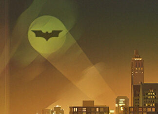 Gotham skyline with bat symbol shining over city buildings at night